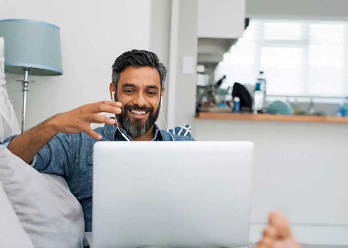 Student researching the cheapest online educational leadership programs from home